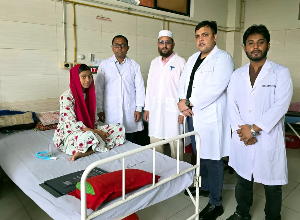 Cardiac surgery clinical team with a post-operative patient in the ward, NICVD