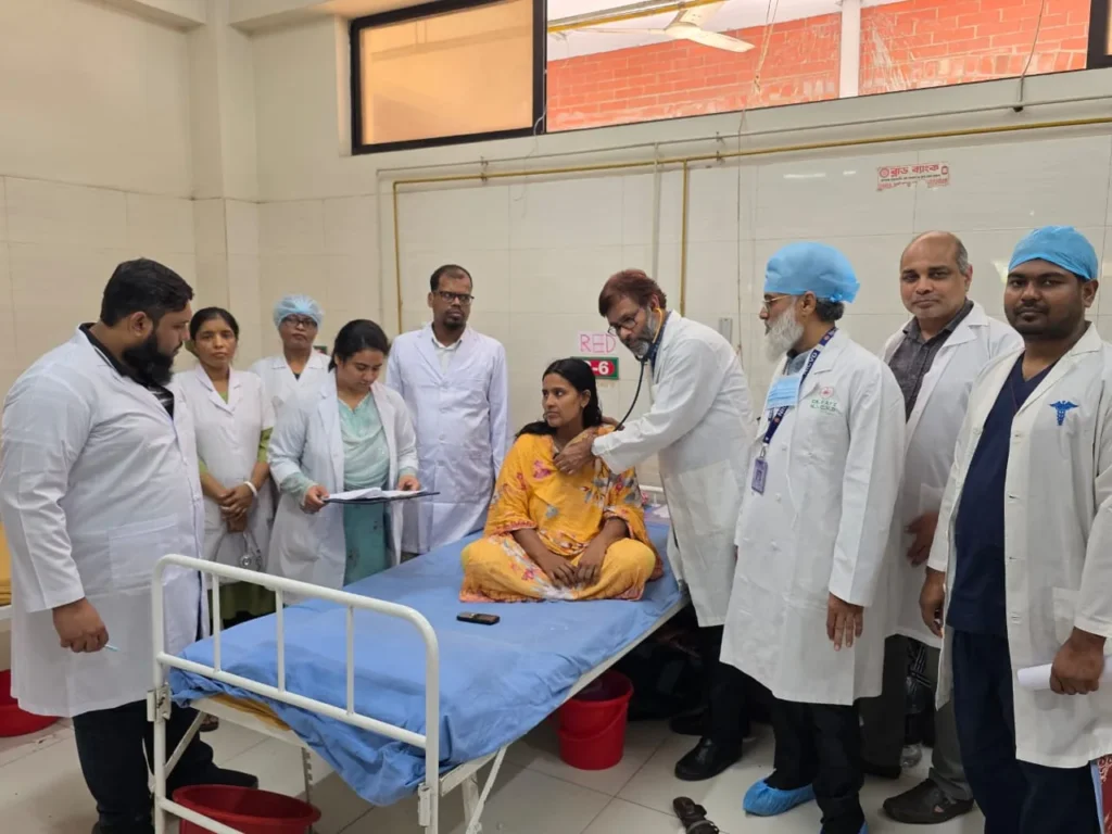 Senior Surgeons Reviewing a Patient at the Bedside
